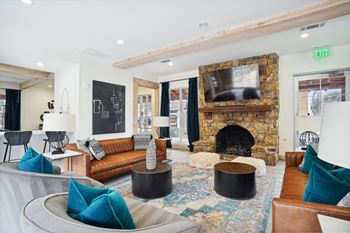 Resident lounge with seating and a TV